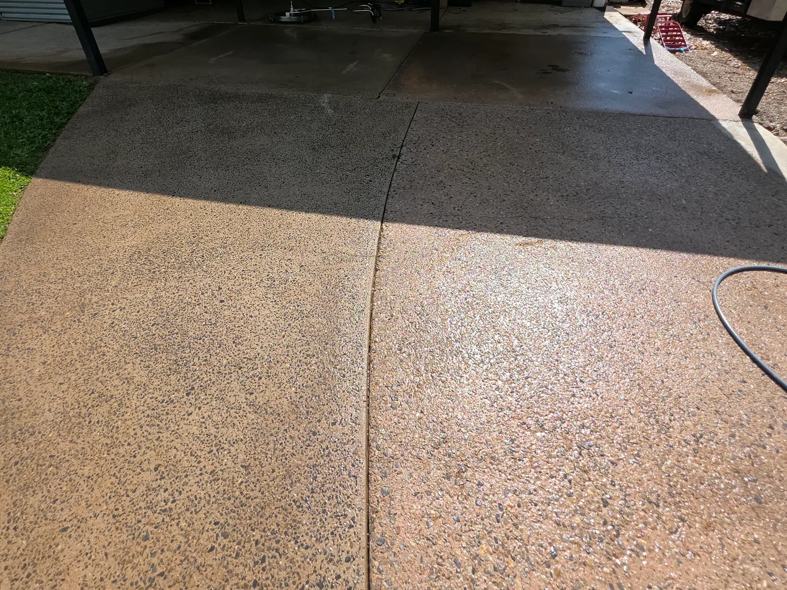 Clean exposed-aggregate driveway after pressure cleaning
