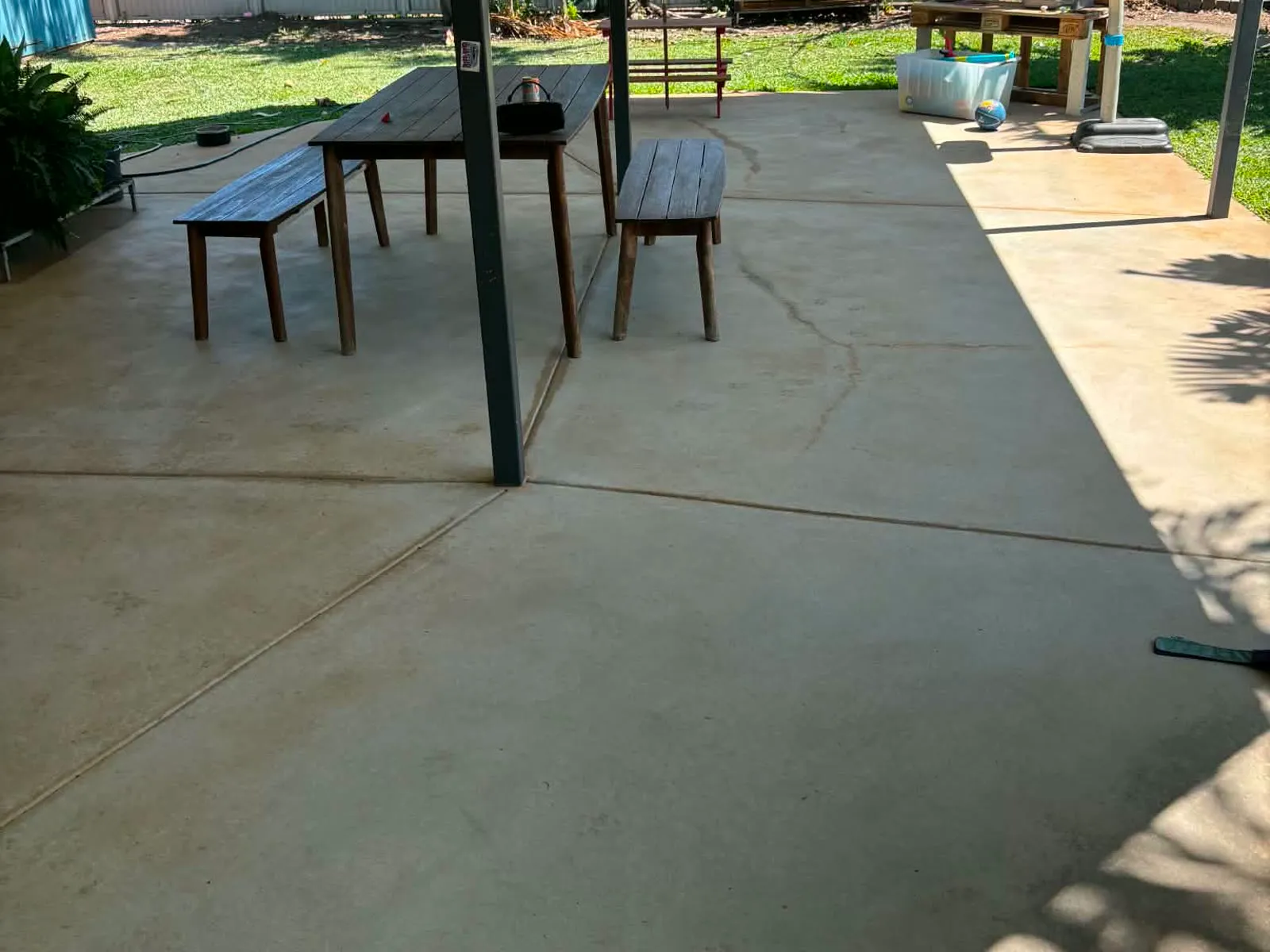 Clean concrete patio after pressure cleaning